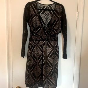 Netting material over nude lining dress